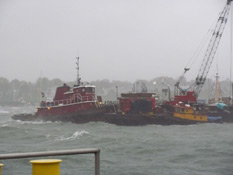 View of the tug Ocean King and a work barge