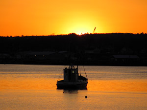 Sun sets over Rockland Harbor