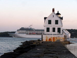 Regatta passes Rockland Breakwater Light