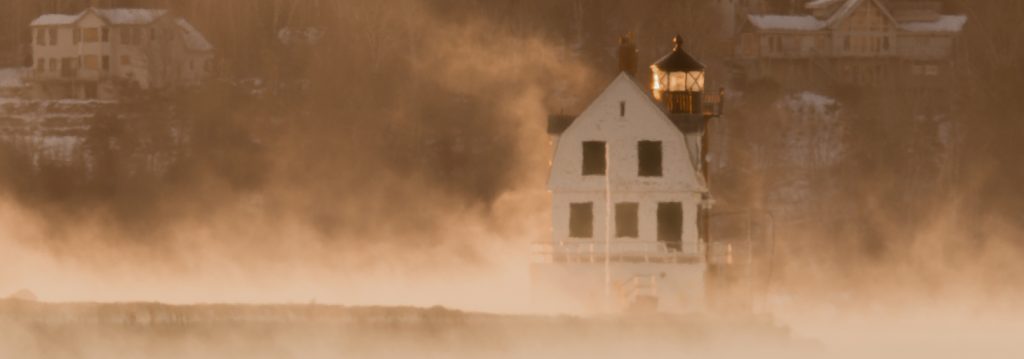 Rockland Breakwater Lighthouse surrounded by sea smoke