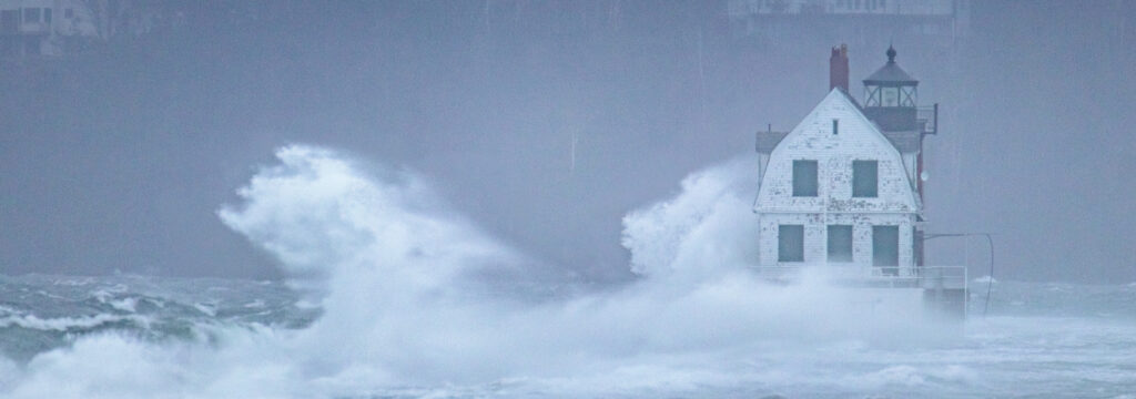 Large waves crash agains the Rockland Breakwater.