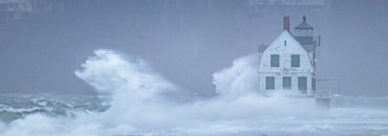 Large waves crash agains the Rockland Breakwater.