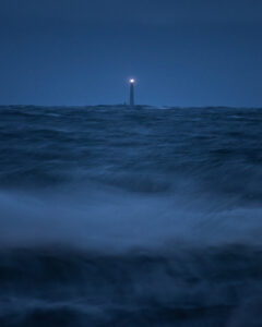 Boon Island Lighthouse can be distantly seen across the rolling swells of the Atlantic.