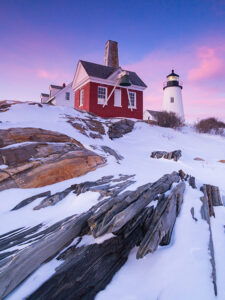 Pemaquid Point Lighthouse under a pink pastel sky.