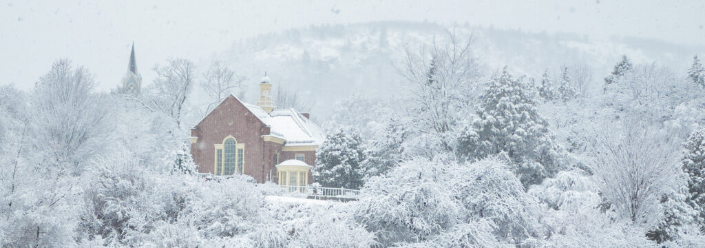 Snowy scene with Mount Battie and the Camden Public Library