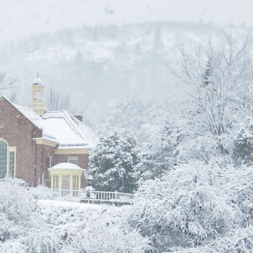 Snowy scene with Mount Battie and the Camden Public Library